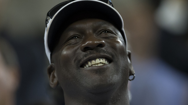 Michael Jordan smiles looking up 