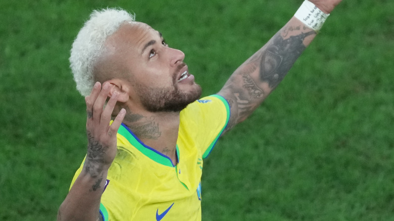 Neymar Jr. celebrates goal arm raised