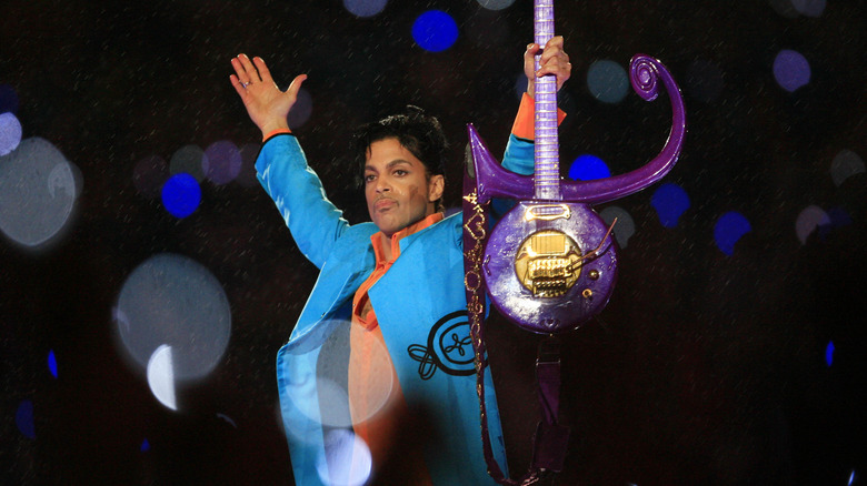 Prince performing playing guitar