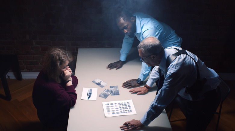 detectives interrogating suspect