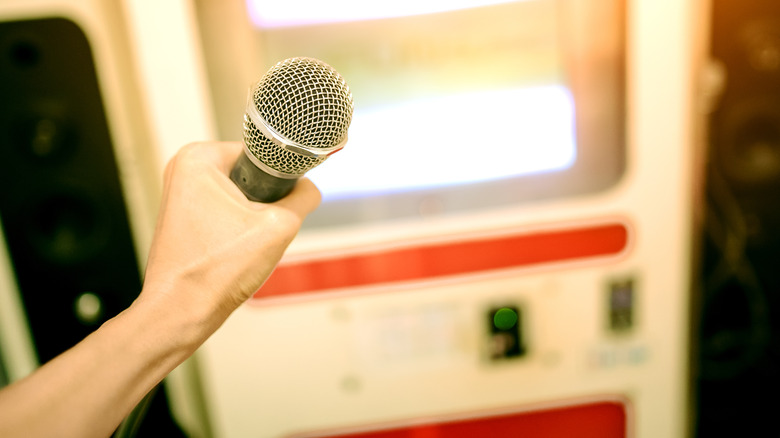 person holding microphone