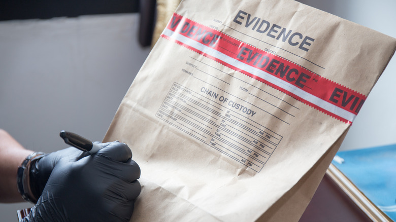 Person writing on an evidence bag