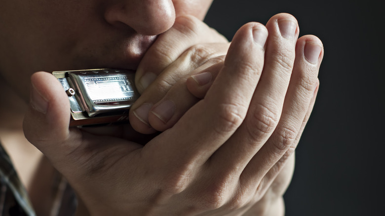 Man playing harmonica