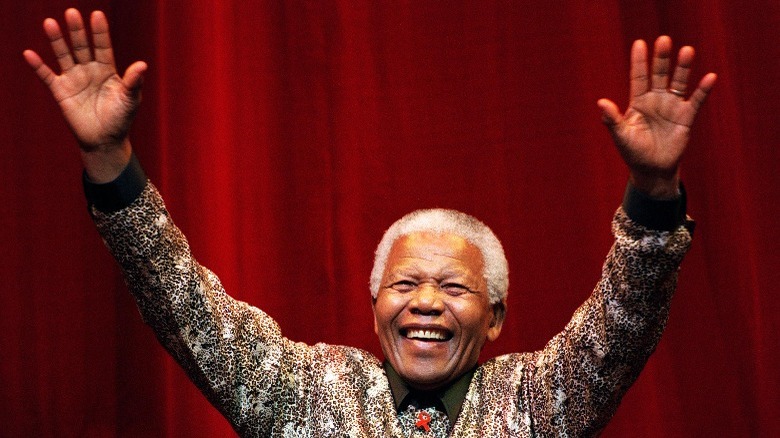 Nelson Mandela waving and smiling