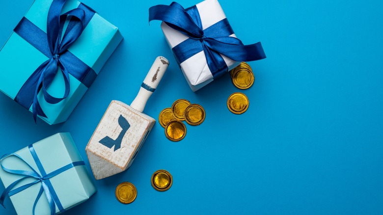 Hanukkah gifts, dreidel, and coins