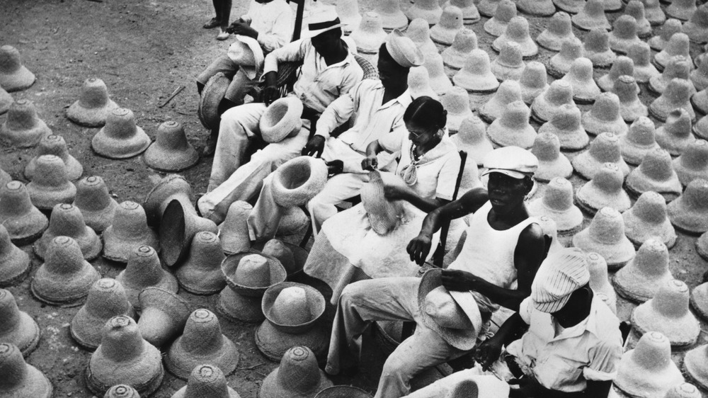circa 1950: Workers in Curacao making hats, one of the island's main trades. 