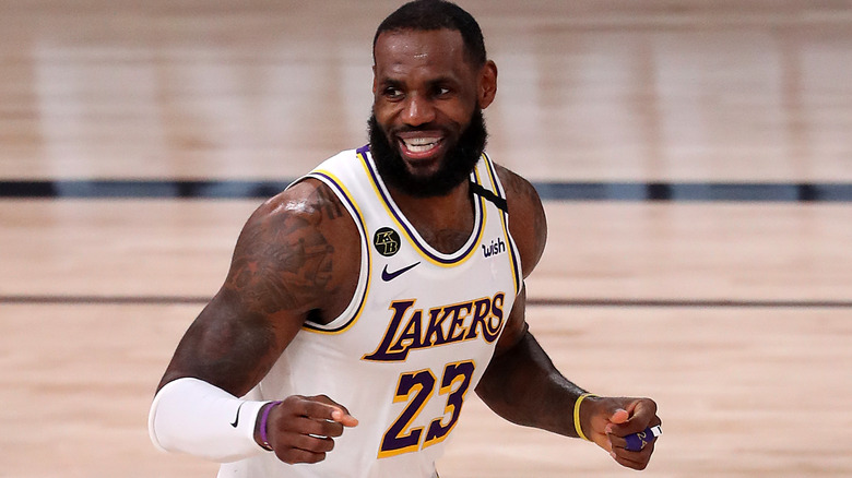 Lebron James smiles white gold jersey