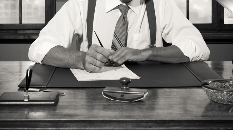 Guy sitting behind a desk