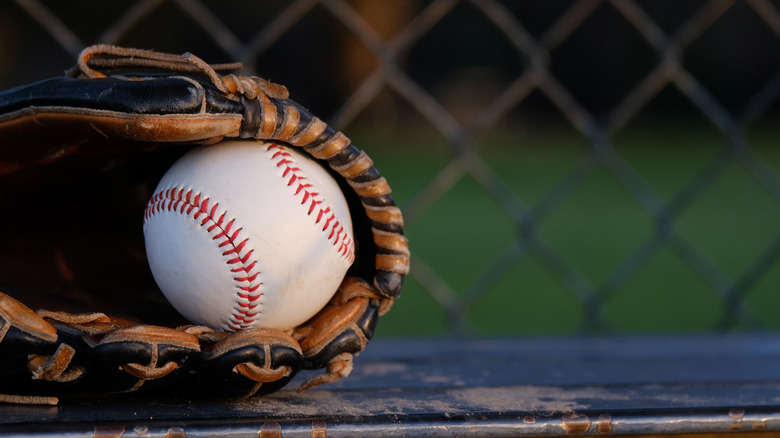 Baseball resting in glove