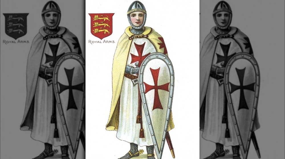 knight templar holding shield with red cross