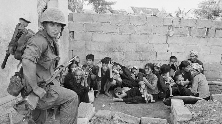 vietnamese civilians huddled together