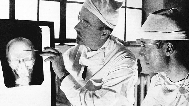 Dr. Walter Freeman examines X-ray, 1941