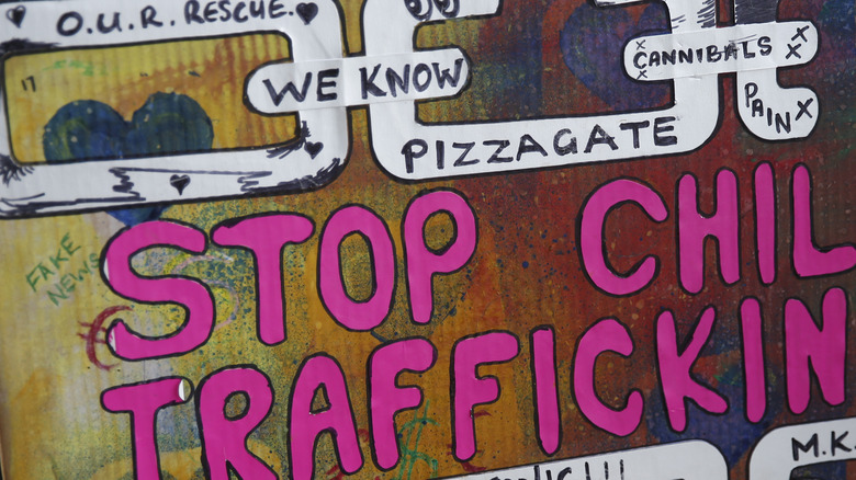 Protest sign arguing belief in Pizzagate