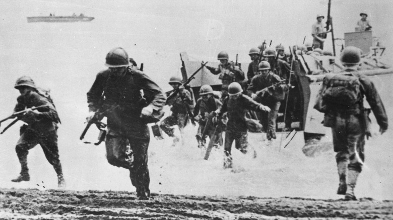 Marines running ashore Guadalcanal