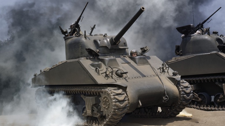 M4 Sherman tank driving through smoke