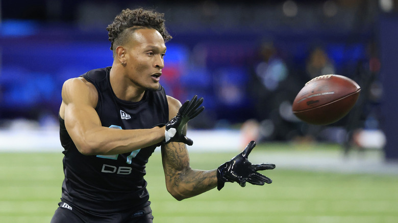 player catching football at NFL Combine