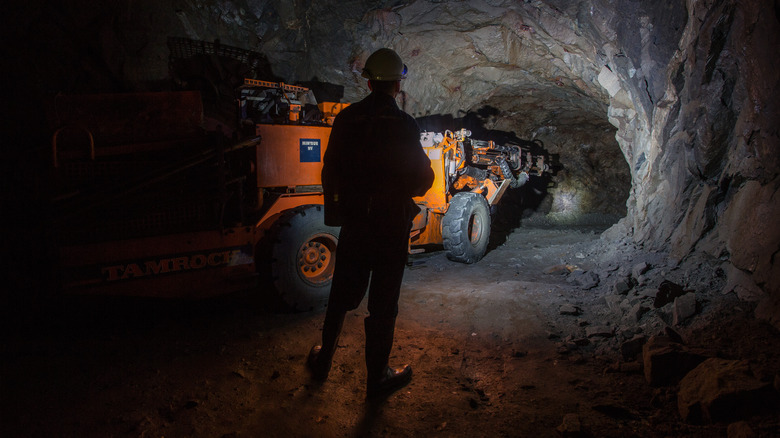 Miner in mine tunnel