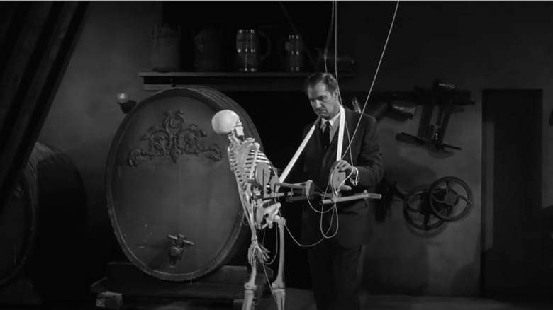 Vincent Price and a skeleton in "House on Haunted Hill."