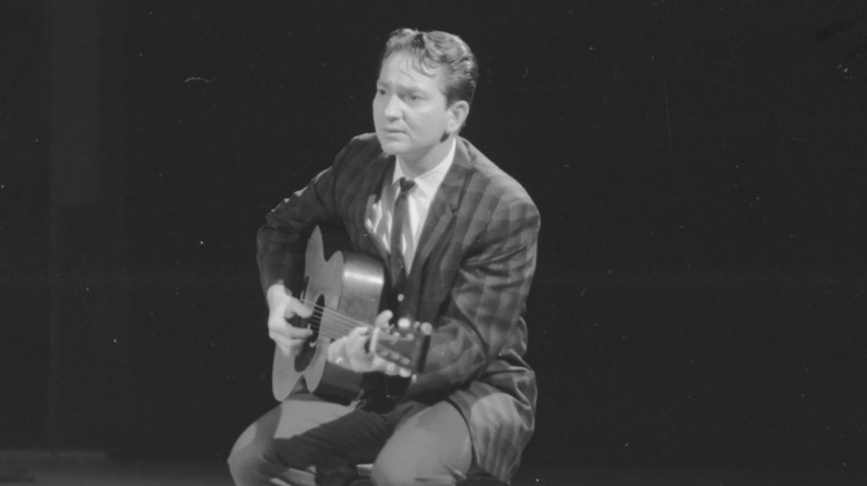 Willie Nelson performing on stage 1960s