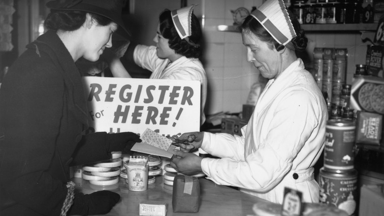 woman shopping in london with rationing coupon books