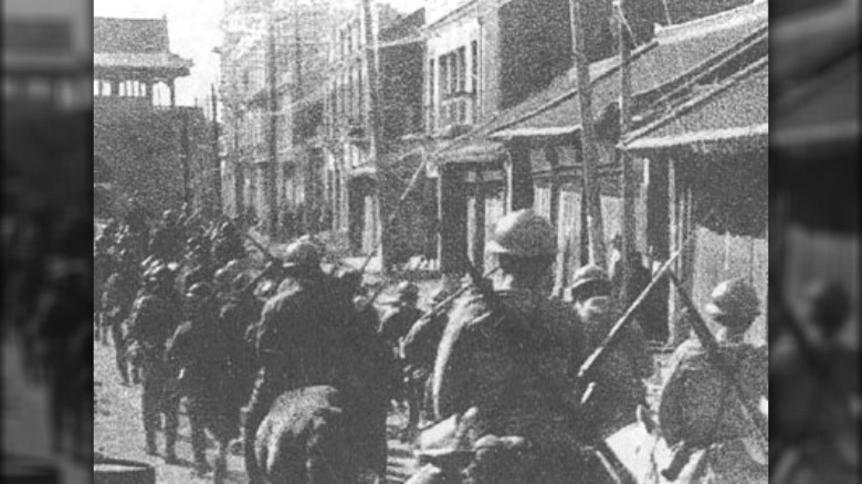 Japanese soldiers marching into China Manchuria