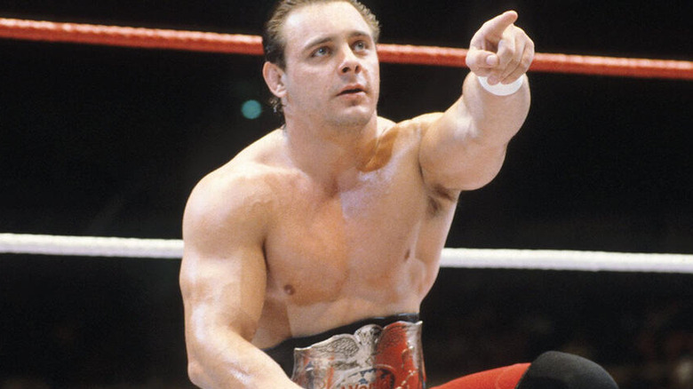 Dynamite Kid sat in ring pointing