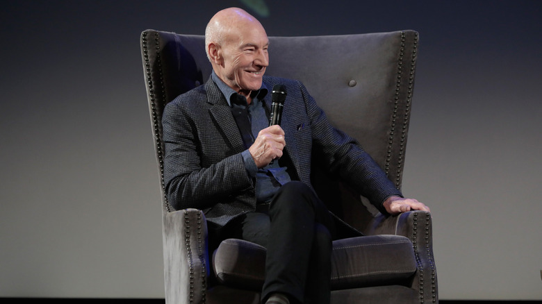 Patrick Stewart sitting in a comfortable chair