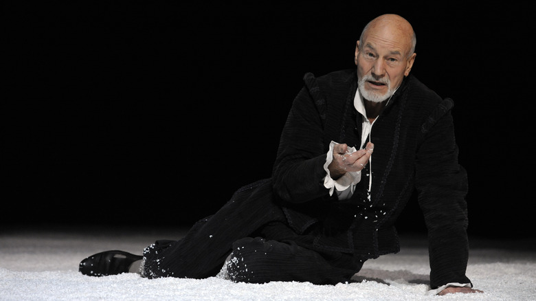 Patrick Stewart laying on stage as Shakespeare