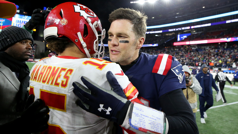 Tom Brady hugs Patrick Mahomes